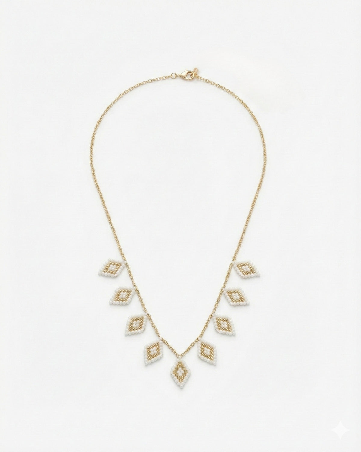 COLLAR OJITOS COLGANDO PURA CHAQUIRA BLANCO DORADO VÍBORA